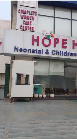 Actual site picture of a white-colored pronto prefabricated guard room installed in front of a women care hospital